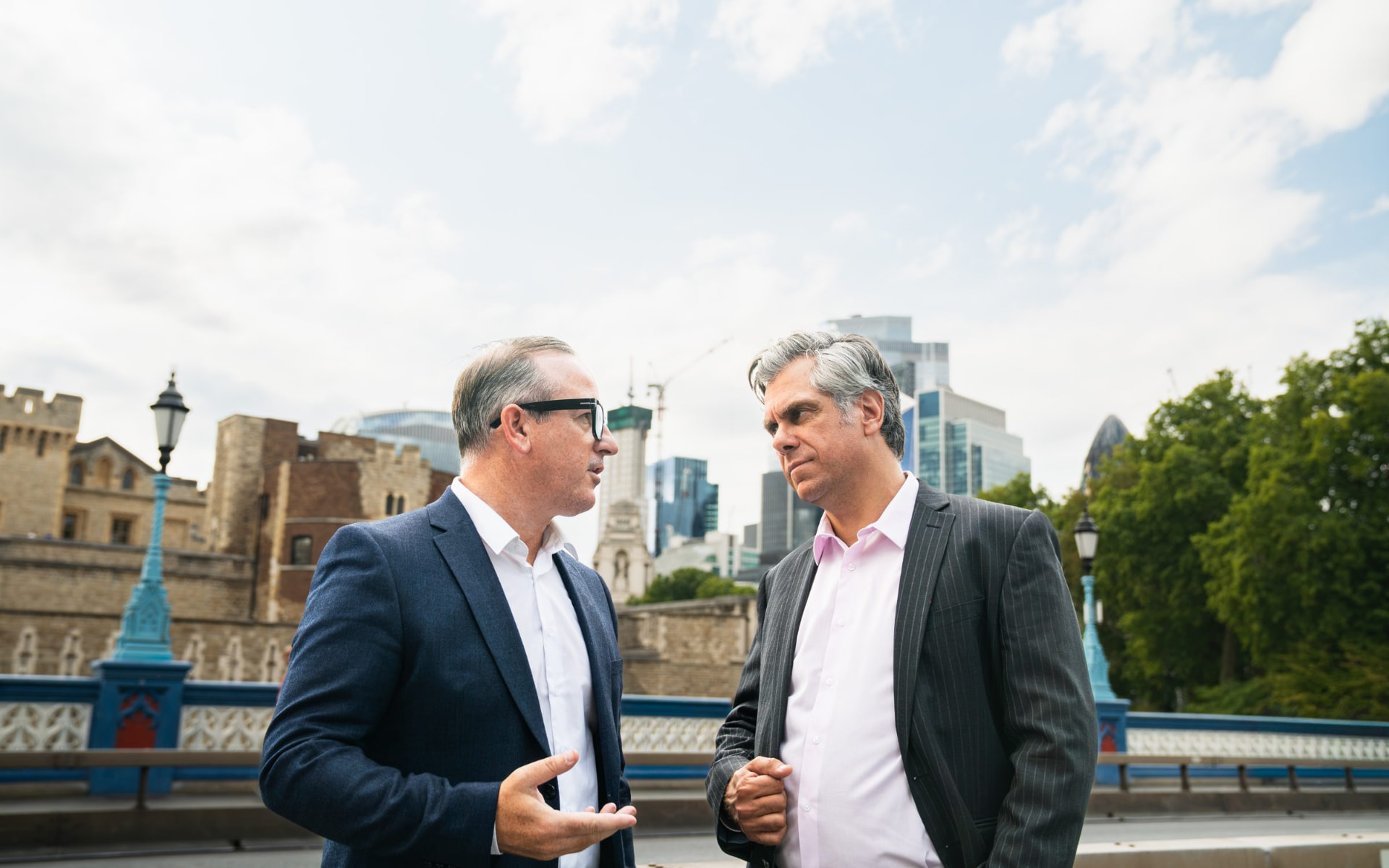 Two Wilton Property Partners team members in conversation on Tower Bridge, London